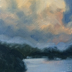An image of a lake and clouds at dusk
